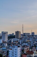 Fototapeta premium Amazing vertical sunset view of District 1 of Saigon in Ho Chi Minh City, Vietnam