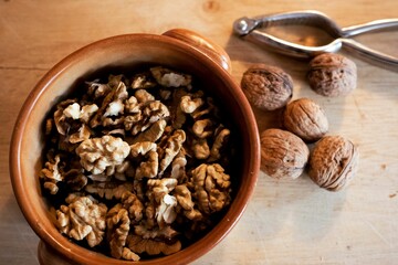 Closeup shot of brown small nuts in the wooden bowl