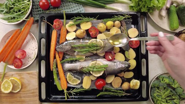 Grilled sea bass fish with aromatic herbs and vegetables