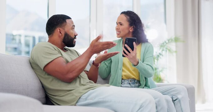 Argue, smartphone and couple on sofa, anger and shouting in living room, disagreement and cheating. Partners, man and woman on sofa, screaming and cellphone with text messages and affair in lounge