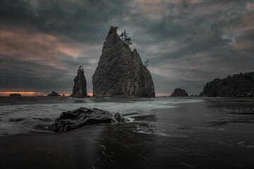 Cliffs at Rialto Beach on a cloudy day. Olympic National Park, Washington State, USA.