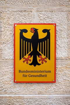 coat of arms of Germany and lettering on a building of the German Federal Ministry of Health