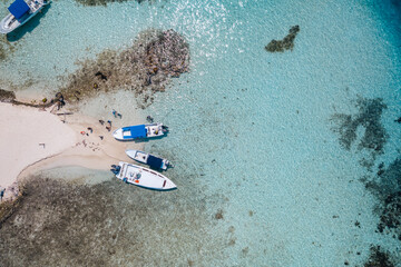 Aerial view of tour boats anchored off South Silk Caye in the Gladden Spit and Silk Cayes Marine Reserve in Belize