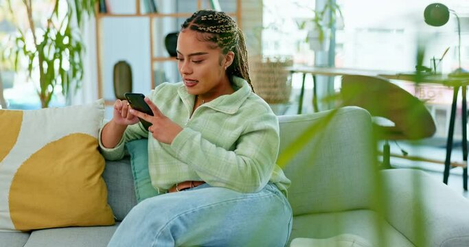 Happy woman, phone and laughing on a sofa at funny meme, post or joke in a living room. Smartphone, relax and girl reading online comic while relaxing on day off with social media, app or website