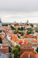 Obraz premium Rooftop view over Tallinn Estonia on cloudy summer day