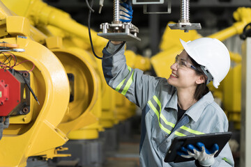 Automated manufacturing industries. Female engineer checking, repair, maintenance autonomous...