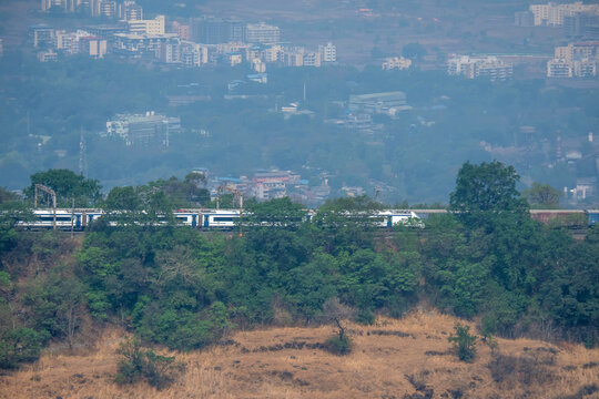 The Solapur to Mumbai Vande Bharat Express travels down hill on the Bhor Ghats at Monkey Hill near Khandala.