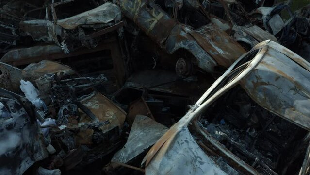Footage of the car cemetery in Bucha, which has become a storage site for destroyed vehicles as a result of the war with Russia. Scenes show hundreds of cars that were wrecked, burned, and completely 