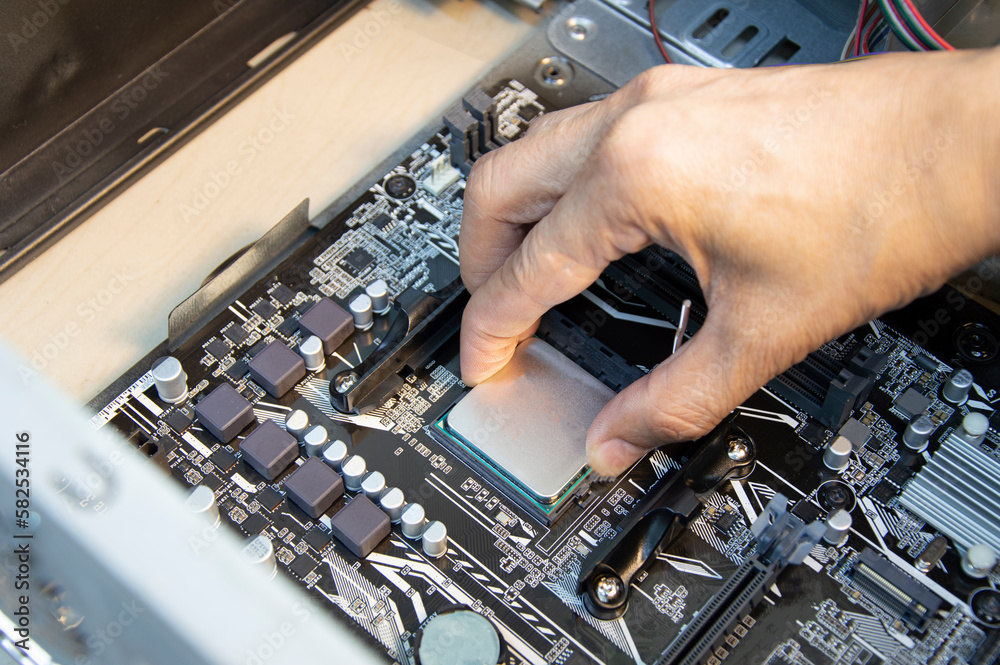 Poster top view technician inserting cpu, computer assembler