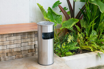 Metal trash bin in garden,cleaning concept.
