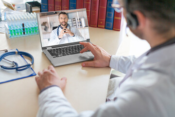 Virtual Consultation Between Two Doctors in Medical Office.