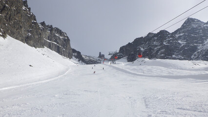 Fototapeta na wymiar Cableway on the glacier and ski slope, landscape