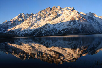 The beautiful Pontet Lake in the french Alps with view on La Meije mountain