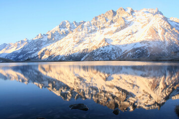 The beautiful Pontet Lake in the french Alps with view on La Meije mountain