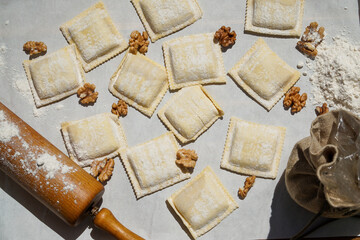 Ravioli pasta with nuts on a white background