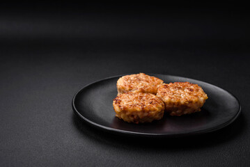 Delicious fresh cutlets or meatballs with spices, herbs and tomato sauce