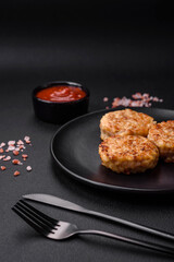 Delicious fresh cutlets or meatballs with spices, herbs and tomato sauce
