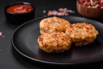 Delicious fresh cutlets or meatballs with spices, herbs and tomato sauce