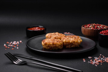 Delicious fresh cutlets or meatballs with spices, herbs and tomato sauce