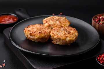Delicious fresh cutlets or meatballs with spices, herbs and tomato sauce