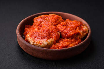 Delicious fresh cutlets or meatballs with spices, herbs and tomato sauce