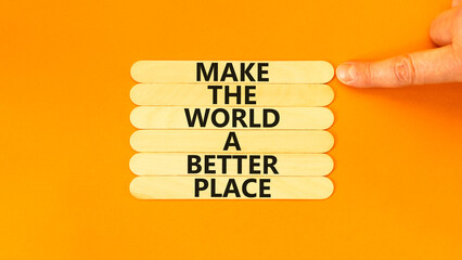 Make a better world symbol. Concept words Make the world a better place on wooden stick. Beautiful...