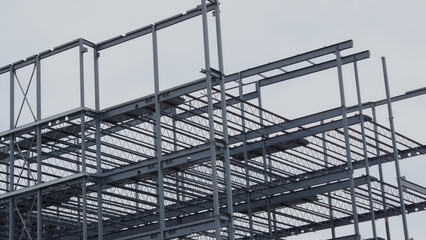 metal beams building corner frame steel structure construction site - obrazy, fototapety, plakaty