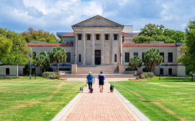 People are walking in front of Law school building at LSU campus. Louisiana State University