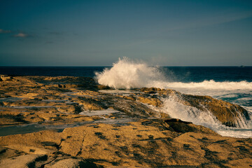 waves crashing on rocks