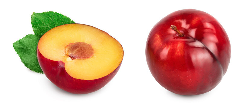 fresh red plum half with leaves isolated on white background