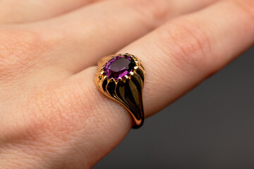 Fancy purple crystal ring background, old vintage jewelry concept, promotional photo for an online jewelry store