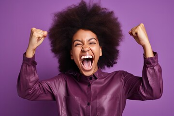 Portrait of a Woman with Fists in the Air Celebrating Success,/Win on a Purple Background (Generative AI)