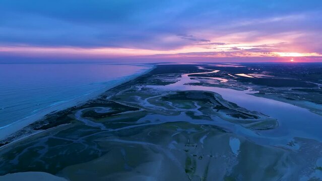 Aerial view from a drone of the landscape of marshes and salt flats of the Ria Formosa Natural Park. Atlantic Ocean. Algarve. Portugal. Europe