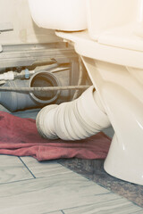 the toilet was clogged and water ran through, a red rag to collect water from the drain...