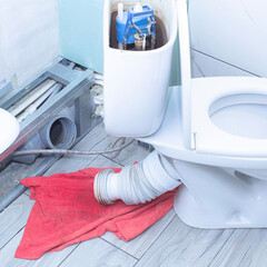 the toilet was clogged and water ran through, a red rag to collect water from the drain...