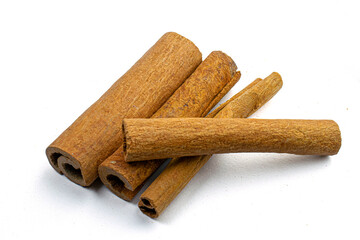 Cinnamon sticks close-up view, macro photography, isolated on white background high quality details