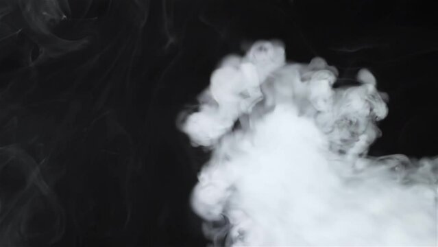 White cigarette smoke on a black background