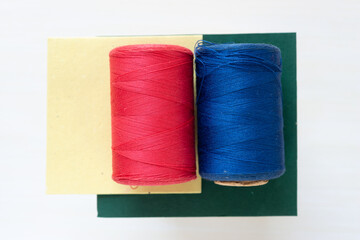 old spools of red and blue thread