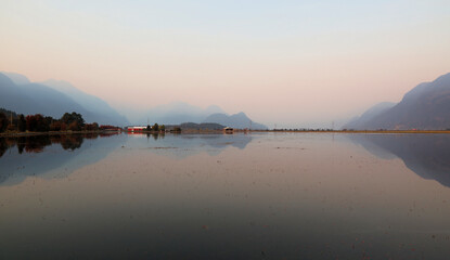 Reflections of very misty tranquil evening