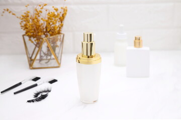 White perfume bottle mockup on wooden table