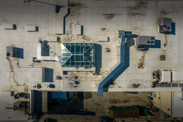 Commercial rooftop with sunlight and HVAC vents
