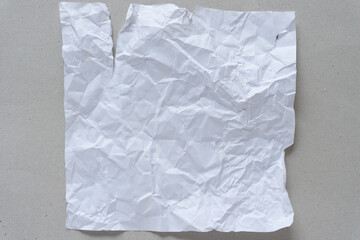 crumpled paper on old gray cardboard background