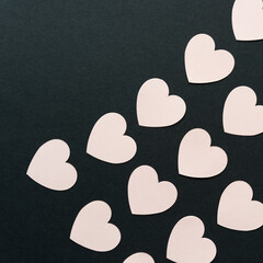 paper hearts on black paper