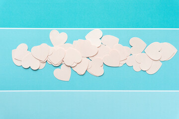 pink paper hearts on blue