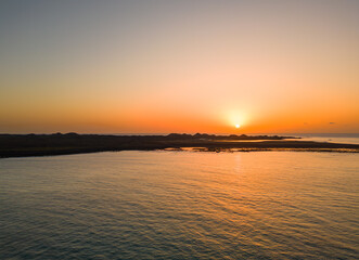 Beautiful warm sunrise view over the water and Lobos island in sunny Fuerteventura Spain 