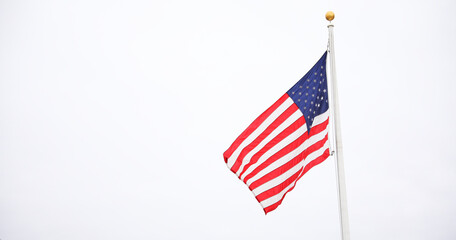 US flag depicting historic freedom and american pride along with independence of fourth of july and patriotism on a national level in the sky and home