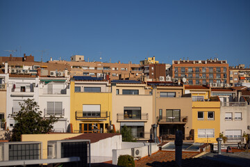 Solar energy panels on the roofs of single-family homes, in Barcelona Spain. Horizontal