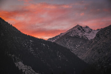 Fototapeta na wymiar Sunset in dolimites di Brenta, Pinzolo, Italy. January 2023.
