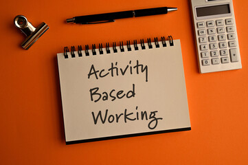 There is a notebook with the word Activity Based Working. It is eye-catching image.