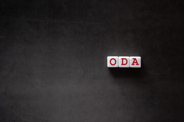 There is white cube with the word ODA. It is an abbreviation for Official Development Assistance as...